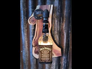 Jack Daniels bottle lamp on hickory live edge. 