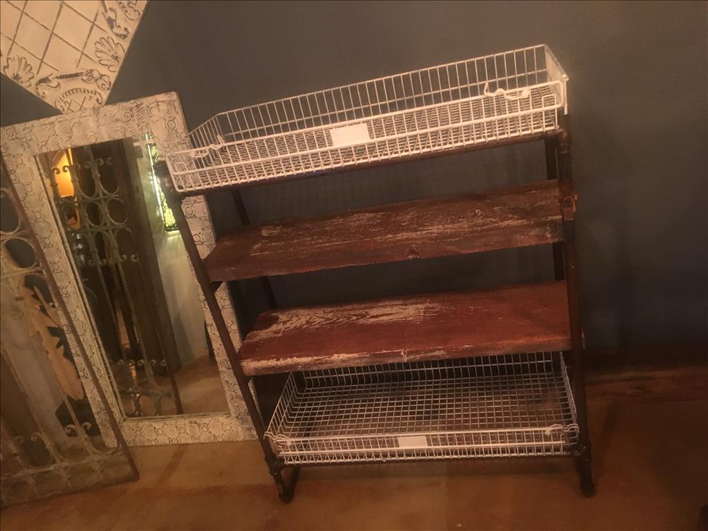 This pipe rack was in in it's early stages and ended up with painted shelving units that matched the(..)