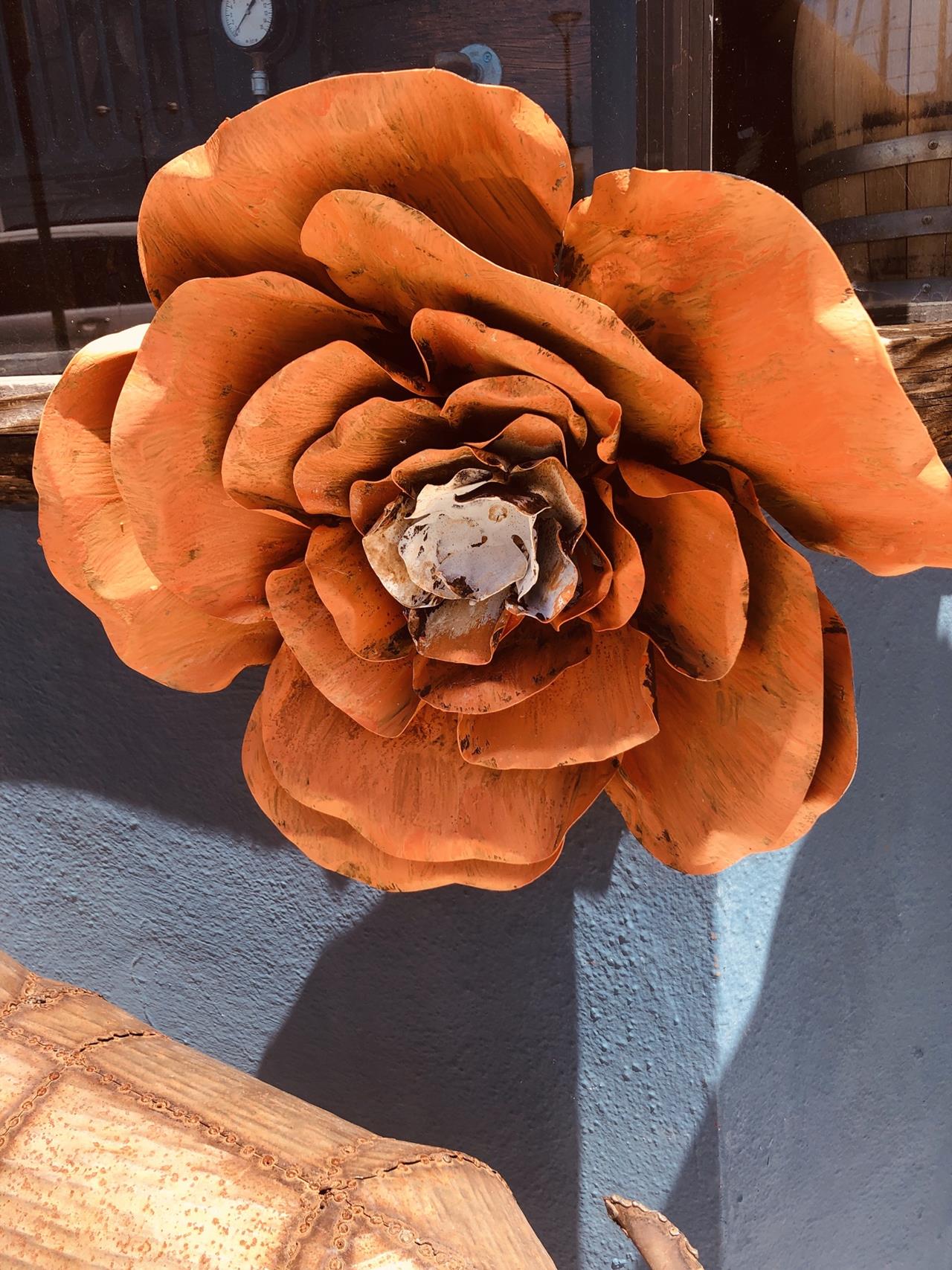 Wall art or yard art . These flowers will cheer up any spot. 