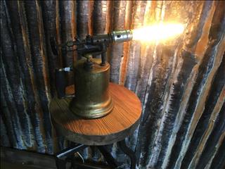 These were like the first welder units... or boom . Steampunk table lamp. 