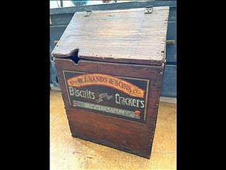 An antique bakery bin