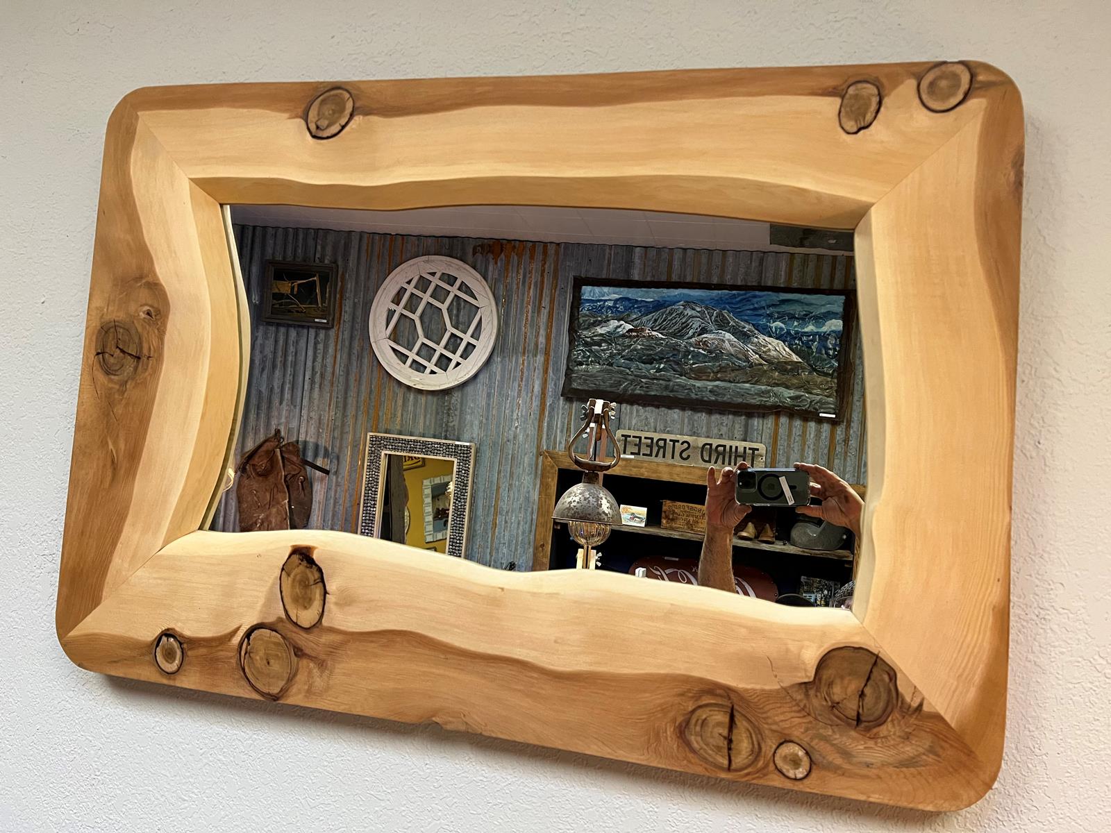 We make mirrors This one is from a live edge tree slab . 